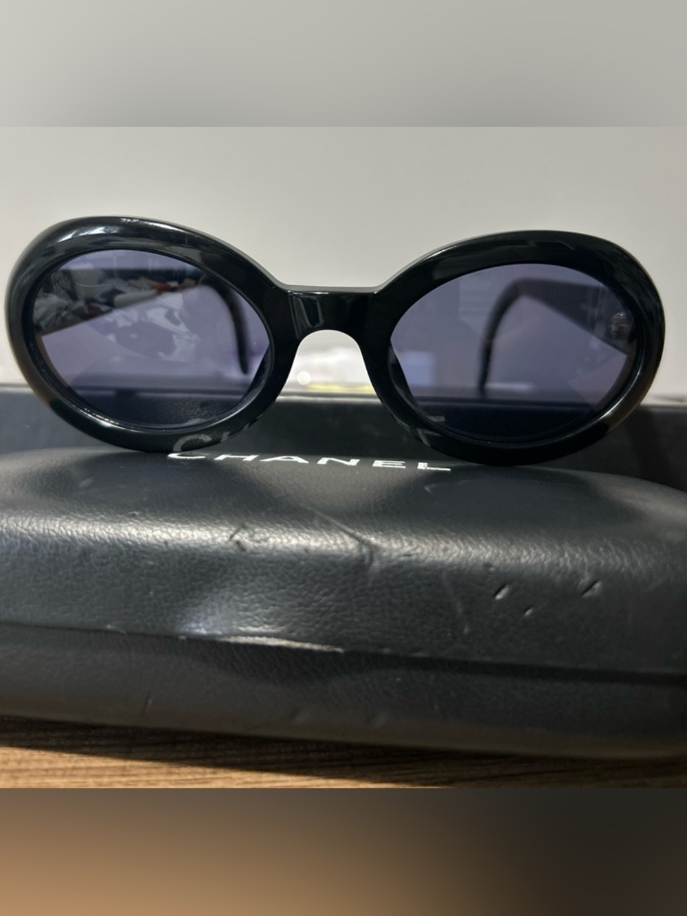 CHANEL Black Oval Women's Sunglasses with Dark Lenses